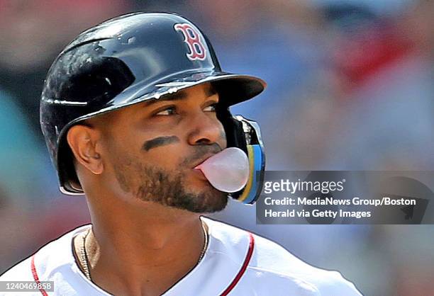 Xander Bogaerts of the Boston Red Sox blows a bubble after striking out during the sixth inning of the MLB game against the Los Angeles Angels at...