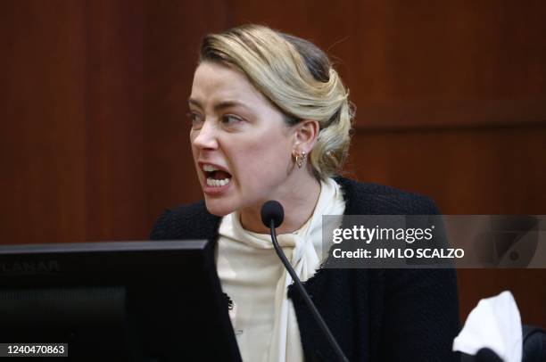 Actress Amber Heard testifies at the Fairfax County Circuit Courthouse in Fairfax, Virginia, on May 5, 2022. - Actor Johnny Depp is suing ex-wife...