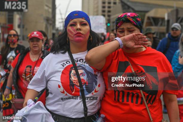 Participants during the annual Red Dress Day march in downtown Edmonton, hosted by Project REDress, commemorating the lives of missing and murdered...