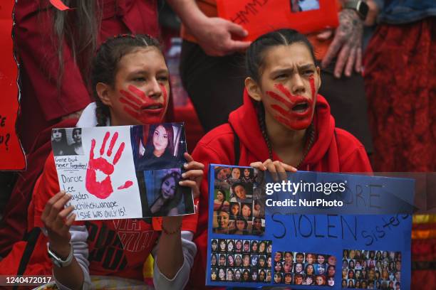 Participants during the annual Red Dress Day march in downtown Edmonton, hosted by Project REDress, commemorating the lives of missing and murdered...