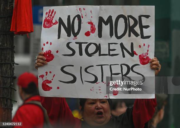 Participants during the annual Red Dress Day march in downtown Edmonton, hosted by Project REDress, commemorating the lives of missing and murdered...