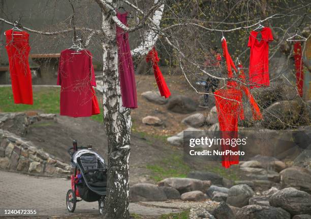 Red dresses hang on the tree. Hundreds of women participated in the annual Red Dress Day march in downtown Edmonton, hosted by Project REDress,...