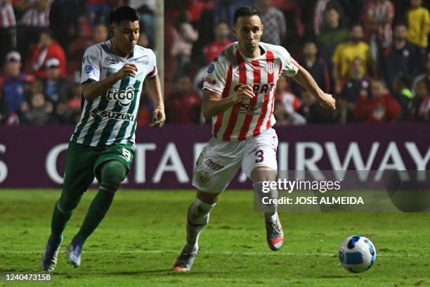 Bolivia's Oriente Petrolero Alexis Ribera and Argentina's Union Santa Fe Claudio Corvalan vie for the ball during their Copa Sudamericana group stage...