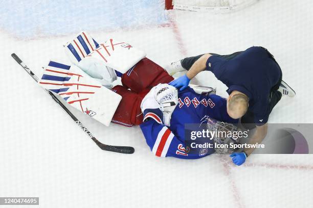 New York Rangers Goaltender Igor Shesterkin iOS examined by medical staffed after being hit by Pittsburgh Penguins Center Jeff Carter during the...