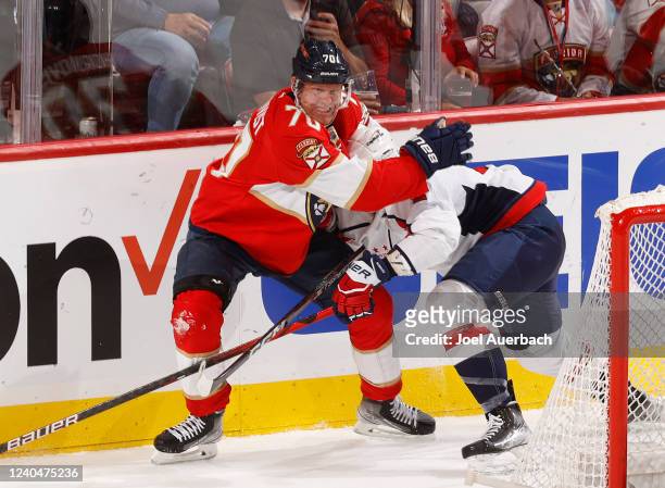 Patric Hornqvist of the Florida Panthers checks Justin Schultz of the Washington Capitals during third period action in Game Two of the First Round...