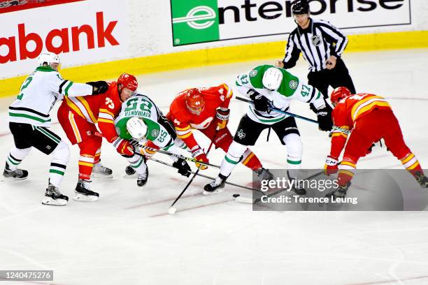 Tyler Toffoli, Erik Gudbranson and teammates of the Calgary Flames skate against Alex Radulov, Joel Kiviranta and teammates of the Dallas Stars in...