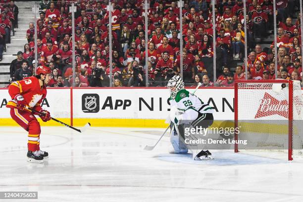 Johnny Gaudreau of the Calgary Flames scores on Jake Oettinger of the Dallas Stars during the first period of Game Two of the First Round of the 2022...