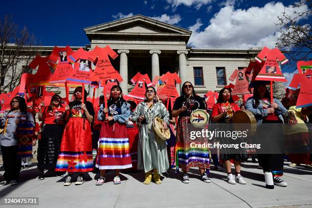 Danae Botella, front center, and people rally and march in honor of National Day of Awareness for Missing and Murdered Indigenous Relatives Day at...
