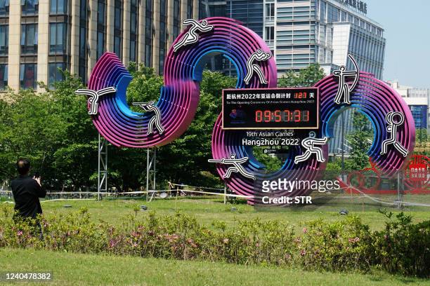 Countdown clock showing 127 days until the opening of the 2022 Asian Games is seen in Hangzhou, in China's eastern Zhejiang province on May 6, 2022....