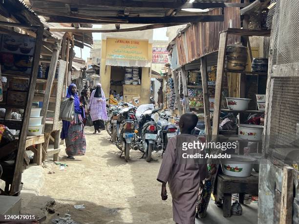Sellers are seen at their stores in Kurmi Market in Kano, Nigeria on April 30, 2022. The nearly 600-year-old Kurmi Market, has an important place on...