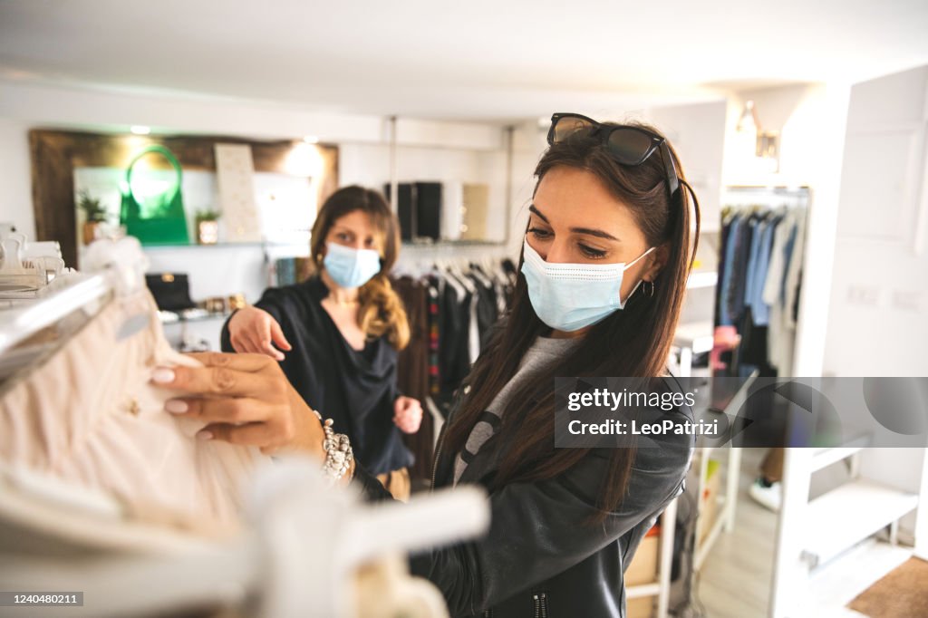 Woman shopping protecting herself wearing protective mask