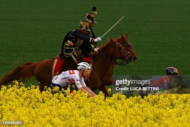 Hungarian hussars ride along competitors during the first stage of the Giro d'Italia 2022 cycling race, 195 kilometers between Budapest and Visegrad,...