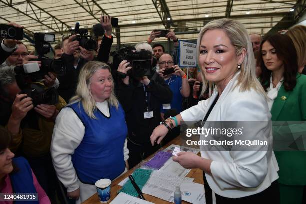 Sinn Fein northern leader Michelle O'Neill is given a wristband and signed in by a count worker as she arrives at the Meadowbank sports arena count...