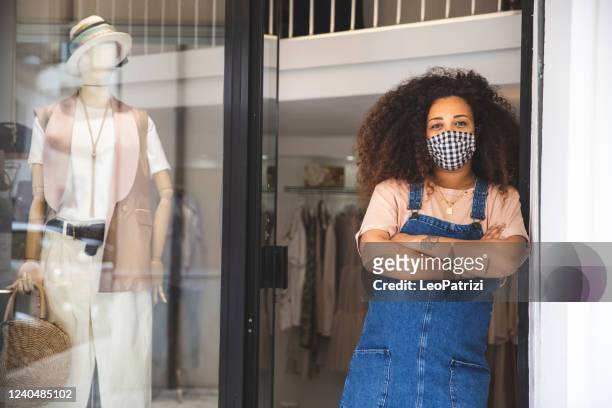 owner boutique store in front of the entrance door - small business mask stock pictures, royalty-free photos & images
