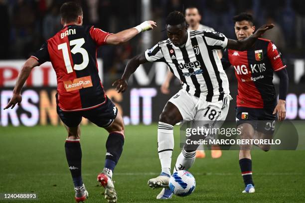 Juventus' Italian forward Moise Kean challenges Genoa's Italian defender Mattia Bani during the Italian Serie A football match between Genoa and...
