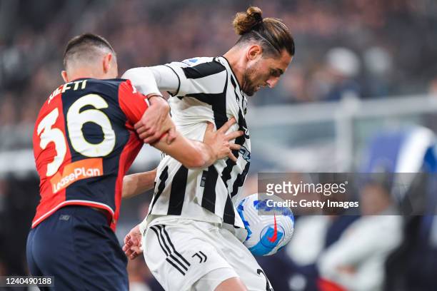 Silvan Hefti of Genoa and Adrien Rabiot of Juventus vie for the ball during the Serie A match between Genoa CFC and Juventus at Stadio Luigi Ferraris...