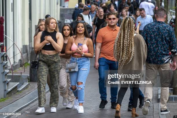 Pedestrians walk in the center of Amsterdam, on May 6, 2022 as the permit for terrace extensions on the Nieuwmarkt and on a large part of the...