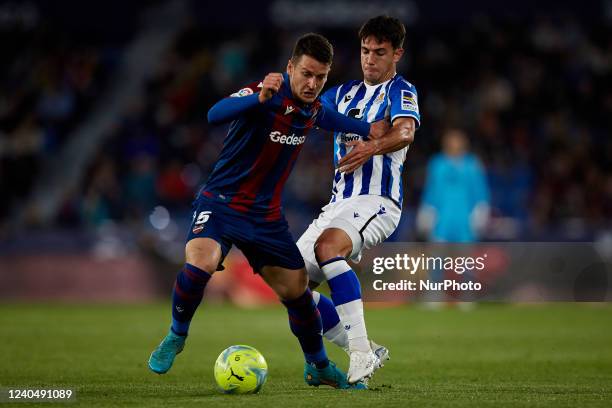 Nemanja Radoja of Levante UD competes for the ball with Zubimendi of Real Sociedad during the La Liga Santander match between Levante UD and Real...