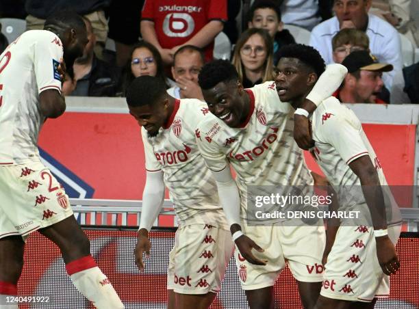 Monaco's midfielder Aurélien Tchouameni celebrates with teammates after scoring a goal during the French L1 football match between Lille OSC and AS...