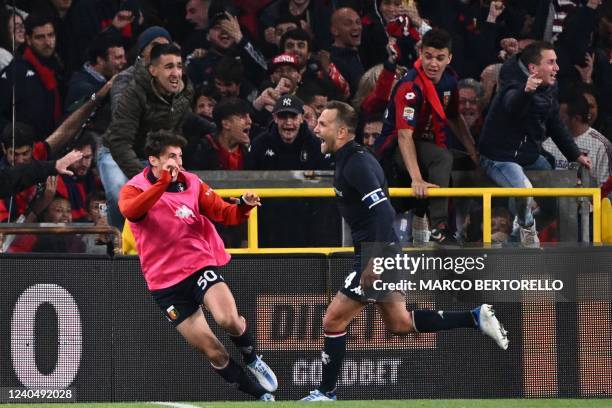Genoa's Italian defender Domenico Criscito celebrates after scoring a last second winning penalty during the Italian Serie A football match between...