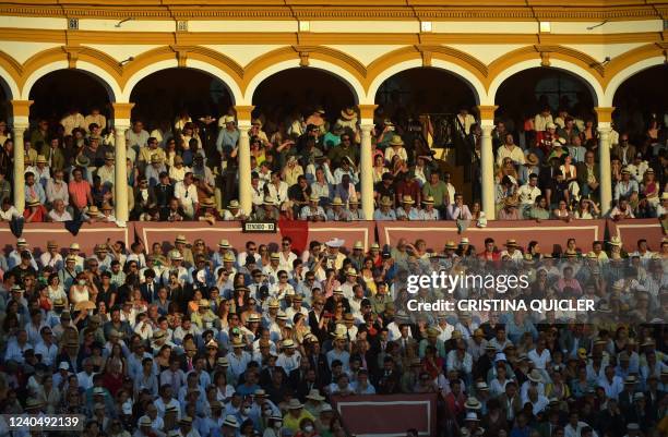 People attend a bullfight during the Feria de Abril bullfighting festival at La Maestranza bullring in Seville on May 6, 2022.