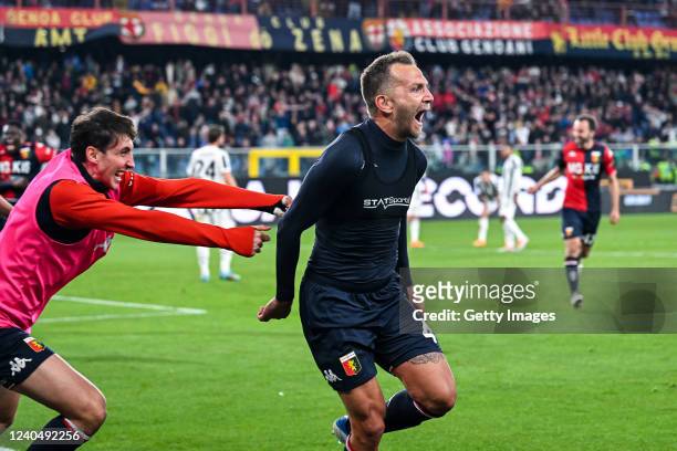 Domenico Criscito of Genoa celebrates with his team-mate Andrea Cambiaso after scoring a goal from the penalty spot during the Serie A match between...
