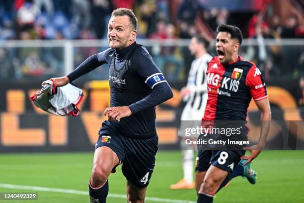 Domenico Criscito of Genoa celebrates with his team-mate Nadiem Amiri after scoring a goal from the penalty spot during the Serie A match between...