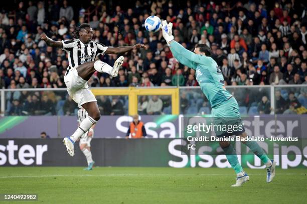 Moise Kean of Juventus and Sirigu of Genoa fight for the ball during the Serie A match between Genoa CFC and Juventus at Stadio Luigi Ferraris on May...