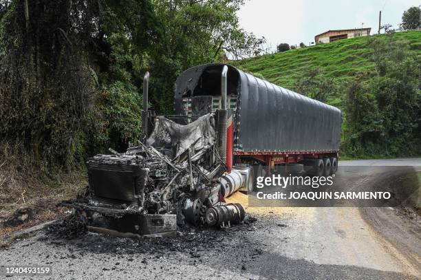 View of a truck burnt by members of the Clan del Golfo drug cartel near San Pedro de los Milagros, Antioquia department, Colombia, on May 6, 2022. -...