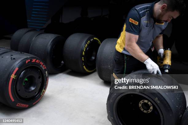 Pirelli staff service tires after the first practice session as the Miami Grand Prix weekend begins at the Miami International Autodrome May 6 in...