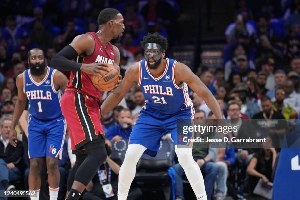 Joel Embiid of the Philadelphia 76ers plays defense on Bam Adebayo of the Miami Heat during Game 3 of the 2022 NBA Playoffs Eastern Conference...