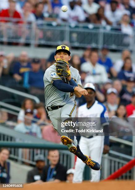 Luis Urias of the Milwaukee Brewers throw to first during the first inning against the Atlanta Braves at Truist Park on May 6, 2022 in Atlanta,...