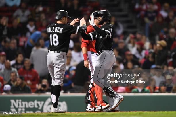 Luis Robert celebrates with teammate AJ Pollock of the Chicago White Sox after hitting a two run home run in the third inning against the Boston Red...