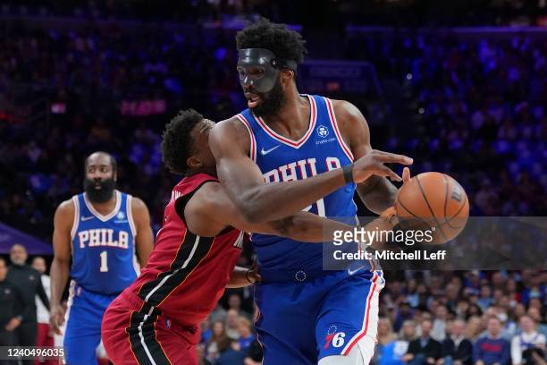 Kyle Lowry of the Miami Heat fouls Joel Embiid of the Philadelphia 76ers in the first half during Game Three of the 2022 NBA Playoffs Eastern...
