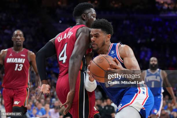 Tobias Harris of the Philadelphia 76ers drives to the basket against Victor Oladipo of the Miami Heat in the first half during Game Three of the 2022...