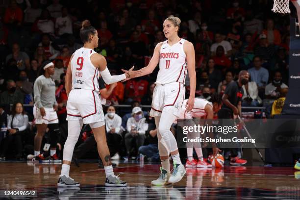Natasha Cloud high fives Elena Delle Donne of the Washington Mystics during the game against the Indiana Fever on May 6, 2022 at Entertainment &...