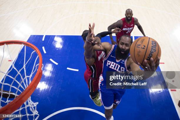 James Harden of the Philadelphia 76ers shoots the ball against Jimmy Butler of the Miami Heat in the first half during Game Three of the 2022 NBA...