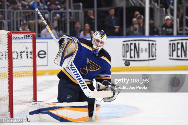 Ville Husso of the St. Louis Blues blocks a shot from the Minnesota Wild in Game Three of the First Round of the 2022 Stanley Cup Playoffs at...