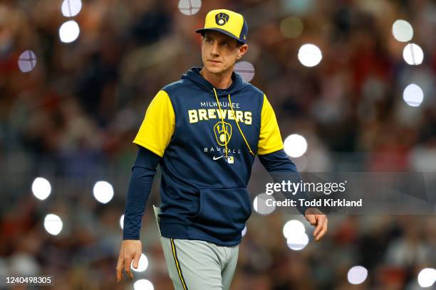 Manager Craig Counsell of the Milwaukee Brewers looks on as he makes a pitching change during the seventh inning against the Atlanta Braves at Truist...