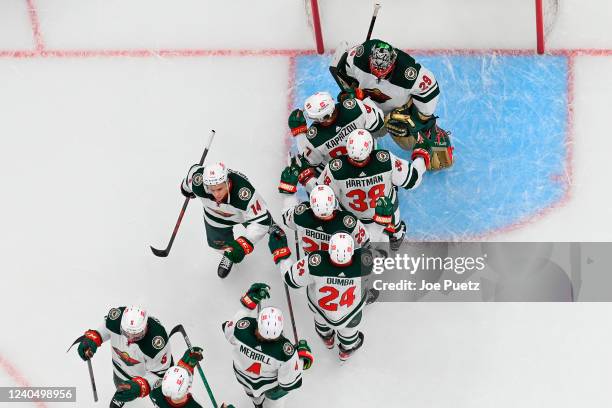 Members of the Minnesota Wild celebrate their 5-1 victory over the St. Louis Blues in Game Three of the First Round of the 2022 Stanley Cup Playoffs...