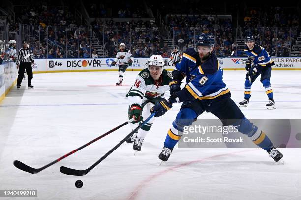 May 6: Joel Eriksson Ek of the Minnesota Wild pressures Marco Scandella of the St. Louis Blues in Game Three of the First Round of the 2022 Stanley...