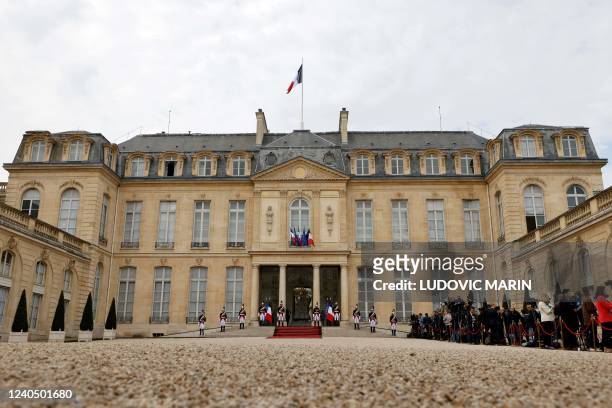 Repuclican guards take position on the front steps of the Elysee presidential palace in Paris on May 7 before the start of the investiture ceremony...
