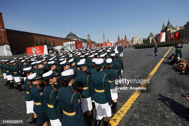 Russian soldiers walk to Red Square by passing through Tverskaya street during the rehearsal of Victory Day military parade marking the 77th...