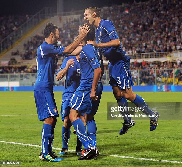 Giampaolo Pazzini of Italy celebrates with his team-mates after scoring during the UEFA EURO 2012 Group C qualifying match between Italy and Slovenia...