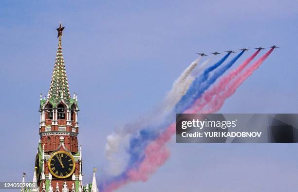 Russian Sukhoi Su-25 jets release smoke in the colours of the Russian flag while flying over Red Square during the general rehearsal of the Victory...