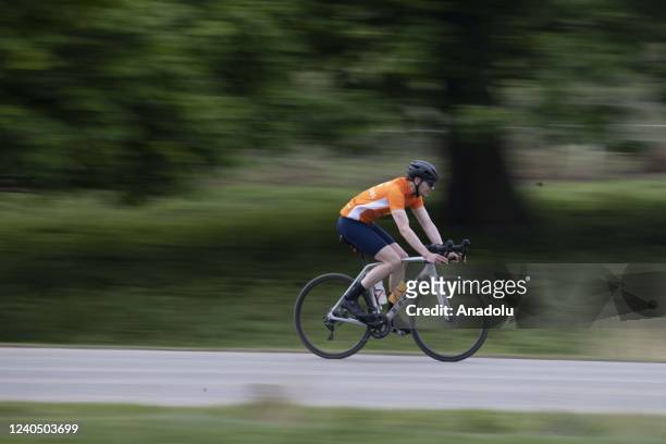 Man rides a bicycle during a sunny day at Richmond Park, in south west London, United Kingdom on May 06, 2022.