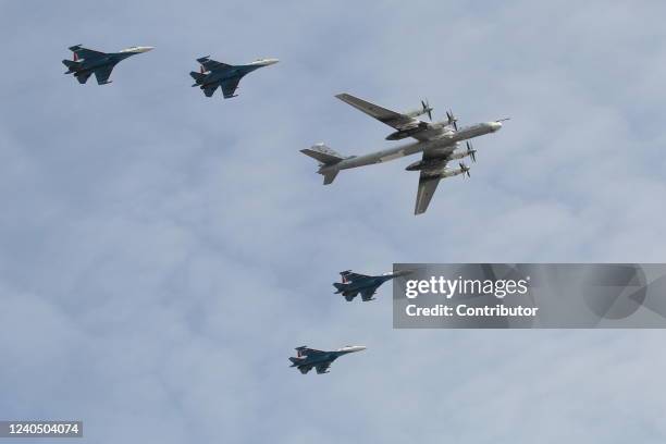 Russian Tupolev TU-95 jet bomber, followed by jet fighters fly over Red Square during the Victory Day Parade main rehearsals, May 7, 2022 in Moscow,...