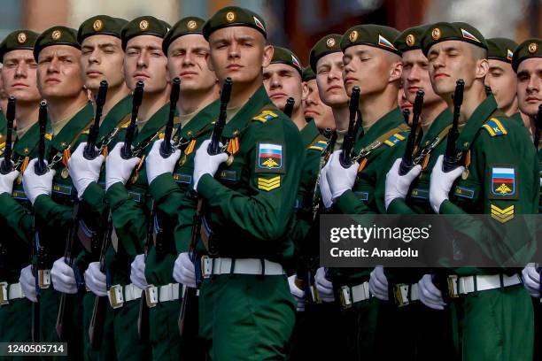 Russian soldiers walk to Red Square by passing through Tverskaya street during the rehearsal of Victory Day military parade marking the 77th...