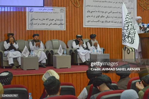 Director Tamiz of the Supreme Court of Taliban Mohammad Sharif leads prayers during a ceremony to announce the decree for Afghan women's dress code...