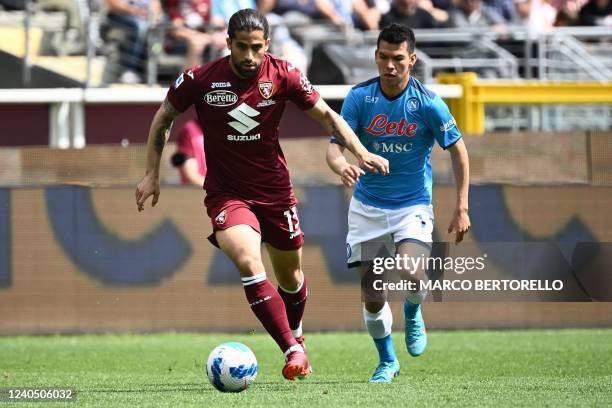 Torino's Swiss defender Ricardo Rodriguez and Napoli's Mexican forward Hirving Lozano go for the ball during the Italian Serie A football match...